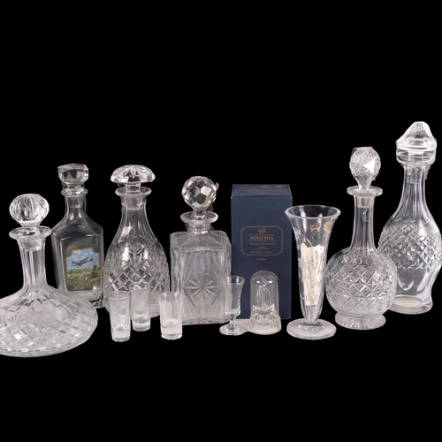 899 - A group of decanters and stoppers, including a ship's decanter, 24cm, vase and glasses