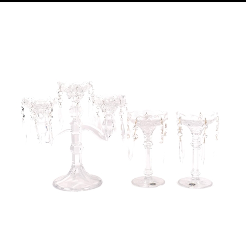 914 - A pair of Bohemian lustre candlesticks, H19.5cm, and a larger glass candelabrum with lustre drops