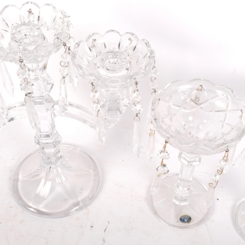 914 - A pair of Bohemian lustre candlesticks, H19.5cm, and a larger glass candelabrum with lustre drops