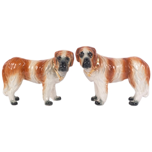 915 - A pair of 19th century Staffordshire St Bernard dog figurines, H24cm (2)