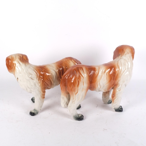 915 - A pair of 19th century Staffordshire St Bernard dog figurines, H24cm (2)