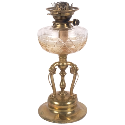 917 - An Art Nouveau brass oil lamp with foliate decorated base, cut-glass font, with chimney, H60cm