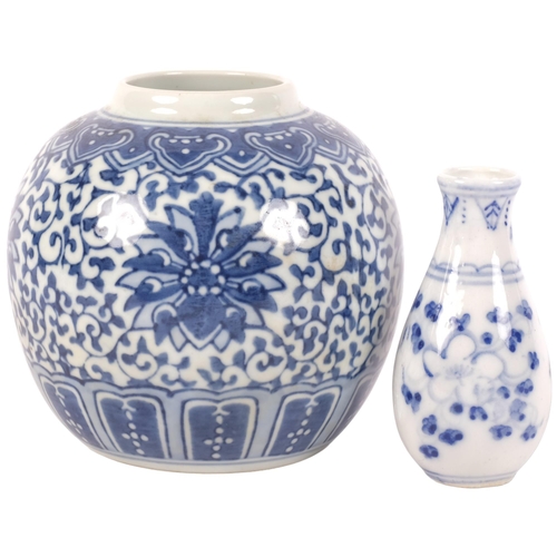 918 - An Oriental porcelain vase with floral decoration, 9.5cm, and a ginger jar