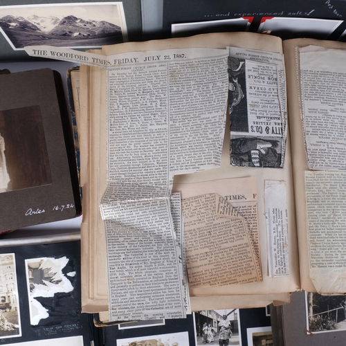 936 - An early 20th century and later family photograph albums, a scrapbook, an atlas etc