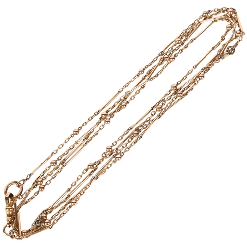 1464 - An 18ct rolled gold fancy link long guard chain, with gold plated dog clip, length 152cm