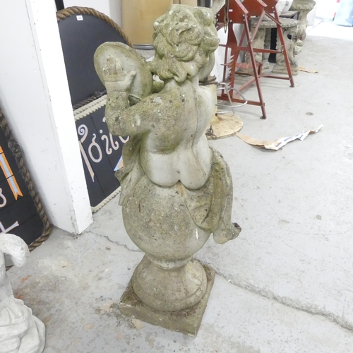 2720 - A weathered concrete garden statue, study of a cherub. Height 100cm.