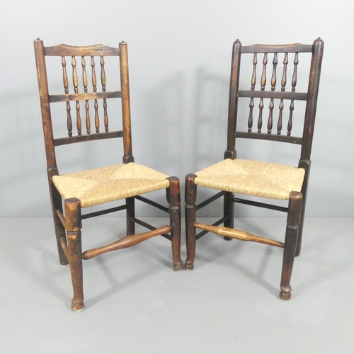 2153 - A matched pair of North Country elm and rush-seated spindle back side chairs.