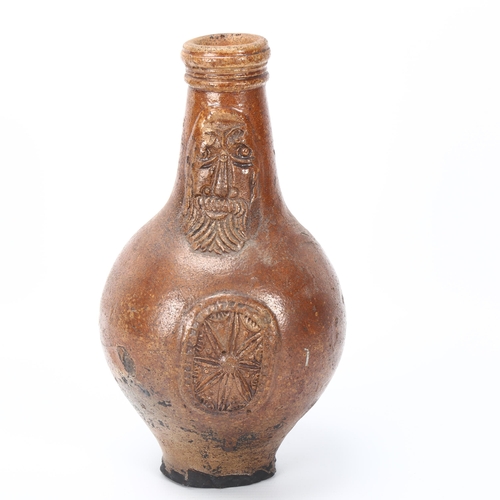 104 - A Bellarmine jug, 16th/17th century salt glazed stoneware, with mask decorated neck and geometric pa... 