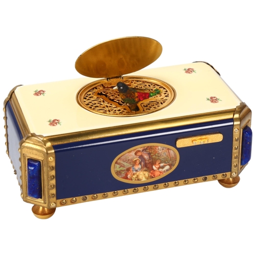 110 - A bird automaton musical box, by Reuge Music Switzerland, blue and cream enamel case with rural scen... 