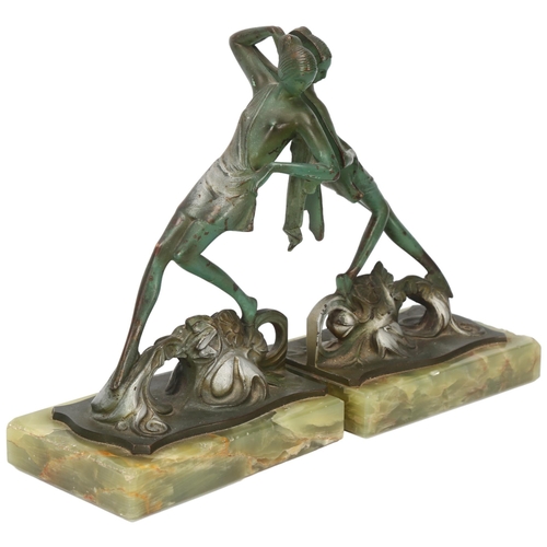 113 - Bruno Zach (1891 - 1935), pair of Art Deco green patinated bronze bookends, in the form of female da... 