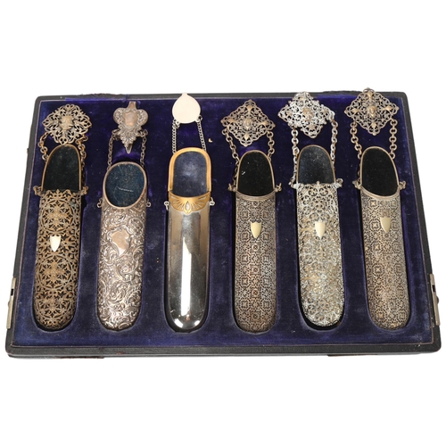 129 - A cased set of 6 x 19th century spectacle cases, steel and nickel plate with belt hooks and chains, ... 