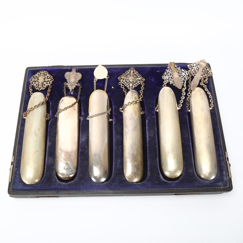 129 - A cased set of 6 x 19th century spectacle cases, steel and nickel plate with belt hooks and chains, ... 