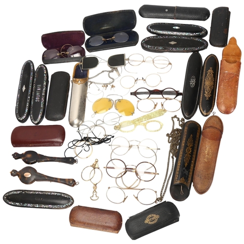 130 - A large collection of mainly 19th century spectacles, monocles, lorgnettes and spectacle cases