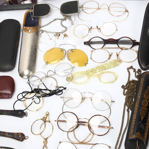 130 - A large collection of mainly 19th century spectacles, monocles, lorgnettes and spectacle cases