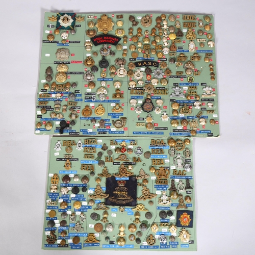 132 - A large collection of military cap badges, buttons, cloth badges and insignia mounted on 18 cards pl... 