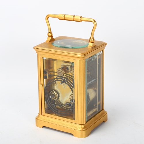 143 - French gilt-brass carriage clock, enamel circular dial in gilded surround, 8-day movement striking o... 