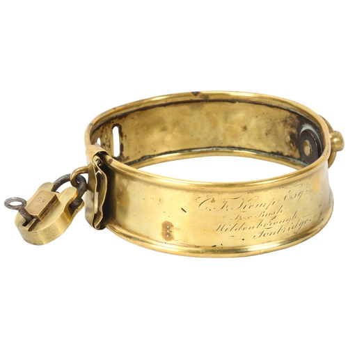 175 - A 19th century brass dog collar with brass padlock and key, inscribed C F Kemp Esq, Fox Bush, Hilden... 