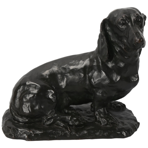 179 - A 20th century patinated bronze Dachshund seated dog, signed to base Carin Trygger, height 25cm, len... 