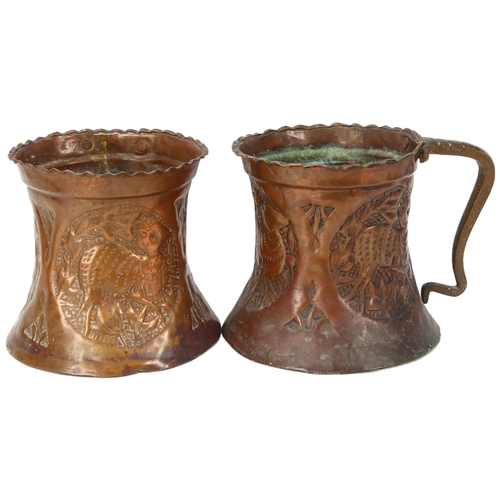 188 - A pair of Middle Eastern copper pots with embossed animal panels and copper handles. height 16cm, di... 