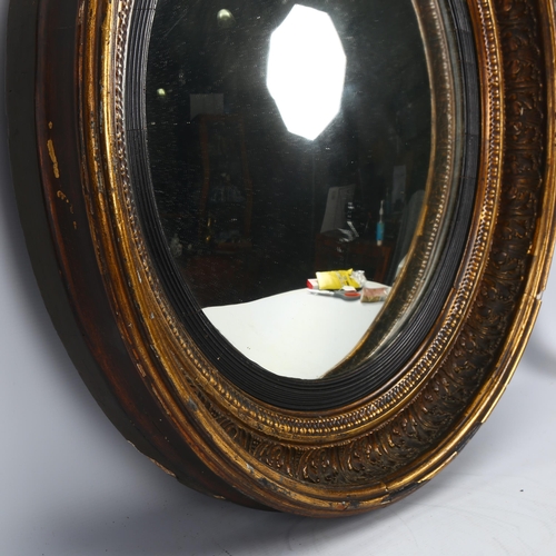 195 - A 19th century gilt-gesso framed convex wall mirror, diameter 65cm