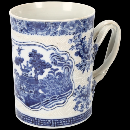 207 - 18th century Chinese export blue and white porcelain mug, landscape decorated panel with crossover h... 