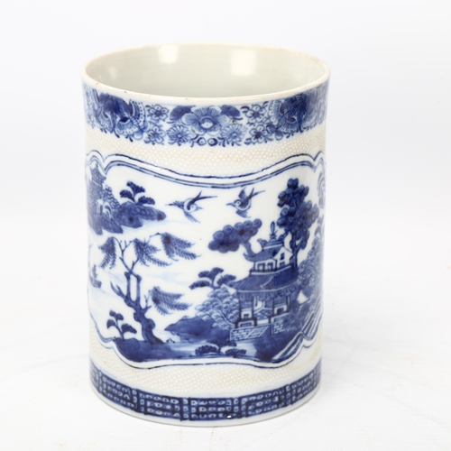 207 - 18th century Chinese export blue and white porcelain mug, landscape decorated panel with crossover h... 