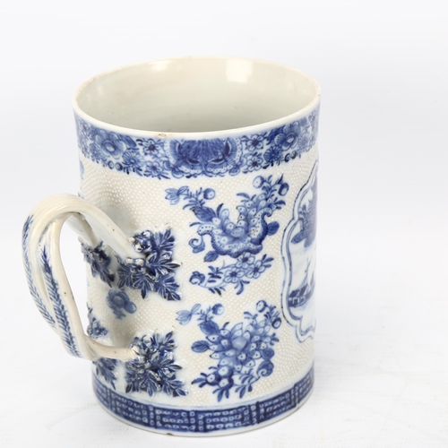 207 - 18th century Chinese export blue and white porcelain mug, landscape decorated panel with crossover h... 