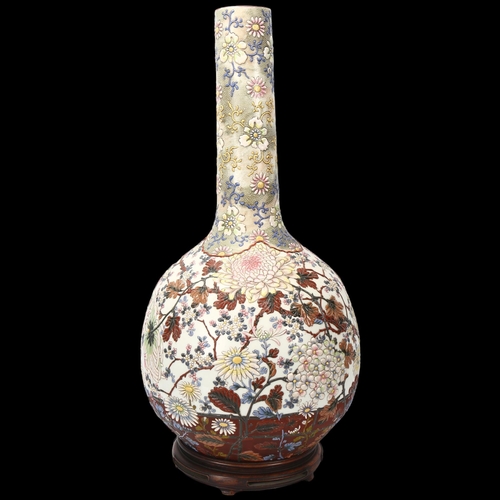 219 - A large Japanese porcelain onion-shaped vase, circa 1900, with enamel blossom design, blossom design... 