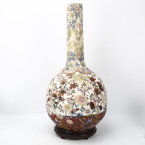 219 - A large Japanese porcelain onion-shaped vase, circa 1900, with enamel blossom design, blossom design... 