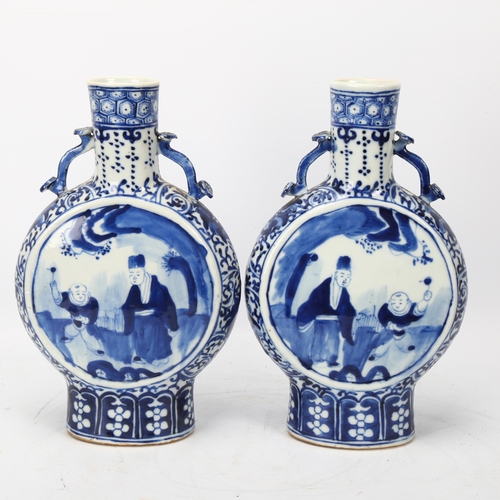 233 - A pair of 19th century Chinese blue and white porcelain moon-shaped vases, sceptre design neck handl... 