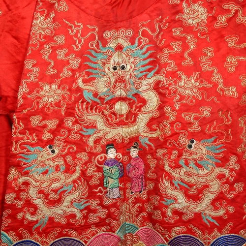 237 - A Chinese red silk jacket with colourful embroidered and gold braid dragons probably early 20th cent... 