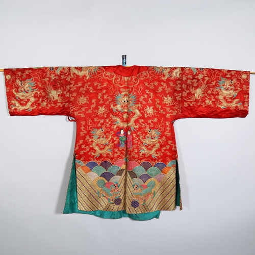 237 - A Chinese red silk jacket with colourful embroidered and gold braid dragons probably early 20th cent... 