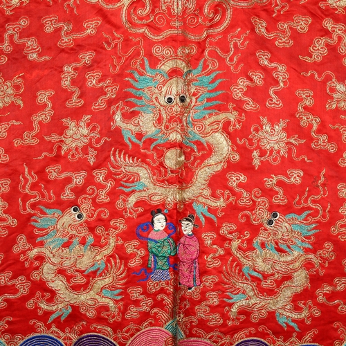 237 - A Chinese red silk jacket with colourful embroidered and gold braid dragons probably early 20th cent... 