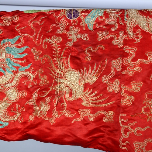 237 - A Chinese red silk jacket with colourful embroidered and gold braid dragons probably early 20th cent... 