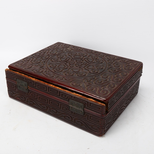 244 - A Chinese Tixi lacquer box of rectangular form, with allover carved geometric design, 26.5cm x 20cm ... 