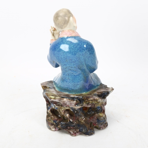 260 - A Chinese porcelain figure cleaning his ears, height 16cm