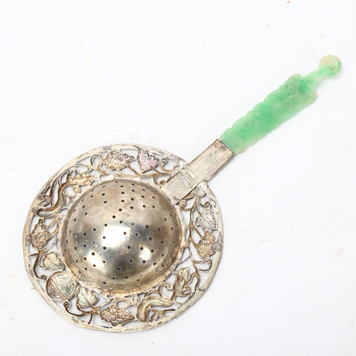 263 - A Chinese silver tea strainer, with relief carved jade handle, length 17cm, in original fitted box