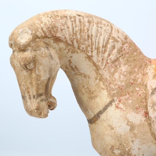 266 - A Chinese Tang style terracotta horse, height 30cm