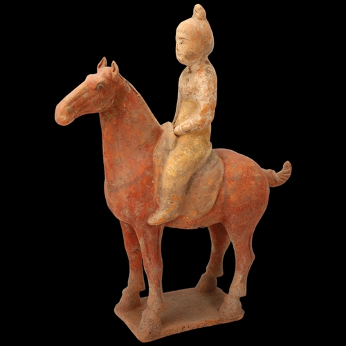 268 - A Chinese Tang style terracotta horse and rider, height 31cm