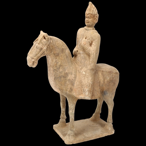 269 - A Chinese Tang style terracotta horse and rider, height 31cm