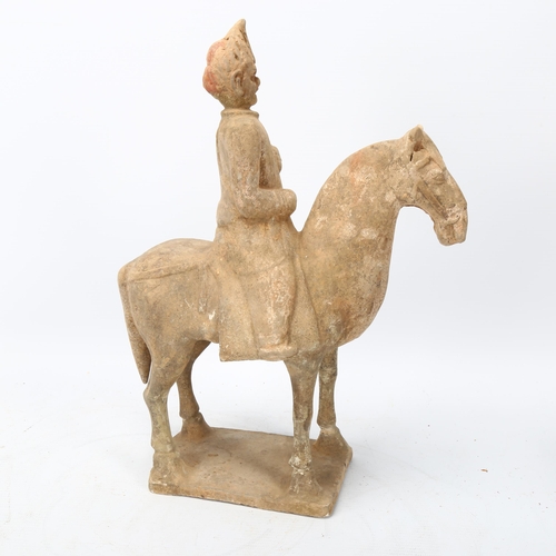 269 - A Chinese Tang style terracotta horse and rider, height 31cm