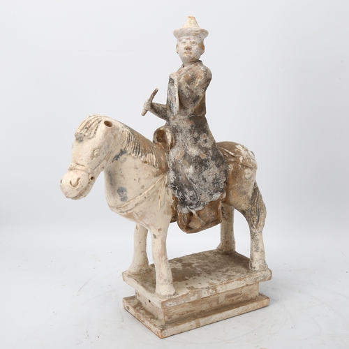 270 - A Chinese Tang style terracotta horse and rider, height 35cm