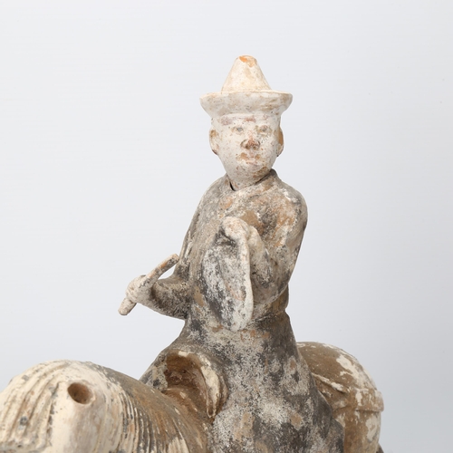 270 - A Chinese Tang style terracotta horse and rider, height 35cm