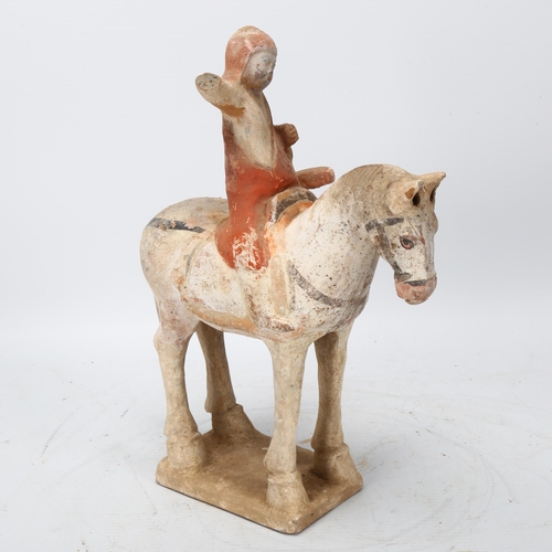 271 - A Chinese Tang style terracotta horse and rider, height 26cm