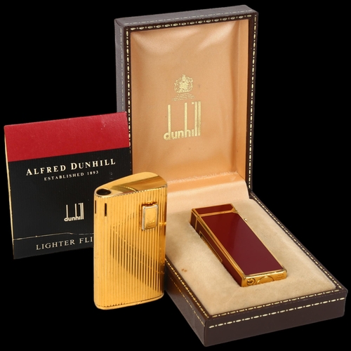 283 - Dunhill red enamel pocket lighter, boxed, and a Ronson gold plated pocket lighter (2)