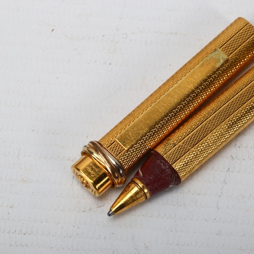 287 - CARTIER - a gold plated ballpoint pen, boxed