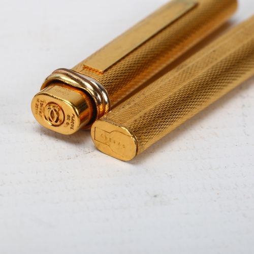 287 - CARTIER - a gold plated ballpoint pen, boxed