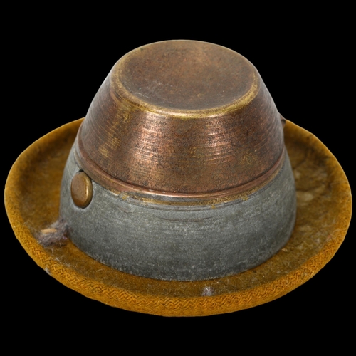 294 - A novelty German hat design travelling inkwell, brass and cloth edged, diameter 8cm