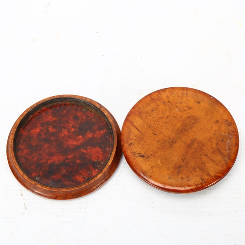 298 - A French early 19th century circular burr-wood snuffbox, pressed relief decorated lid inscribed 