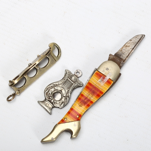 306 - A lady's leg design novelty penknife, an ice skate design cigar cutter, and an unmarked lyre-shaped ... 